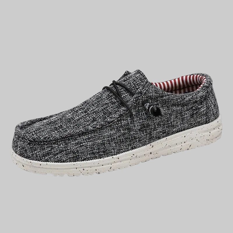 Gray casual shoe with white sole on a white background