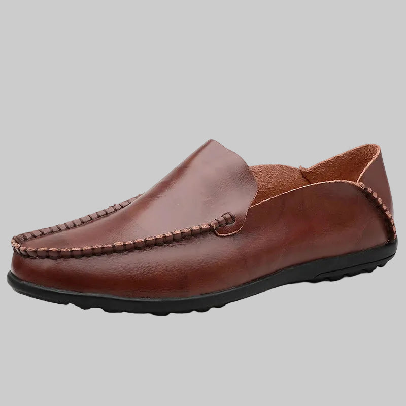 Brown leather loafer shoe on a white background