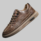 Brown leather sneaker on a gray background