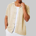 Beige knitted vest worn by a person on a white background