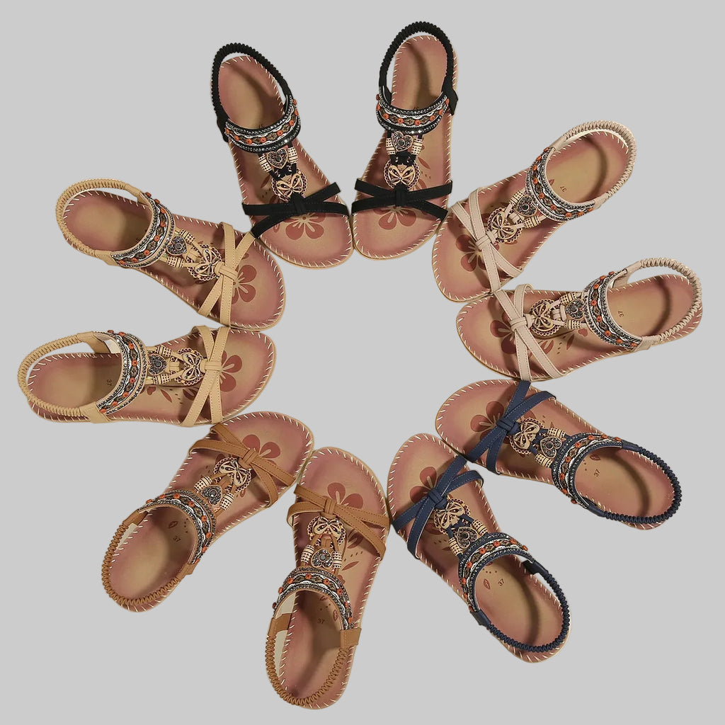 Set of decorative sandals arranged in a circular pattern on a beige background