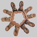 Set of decorative sandals arranged in a circular pattern on a beige background